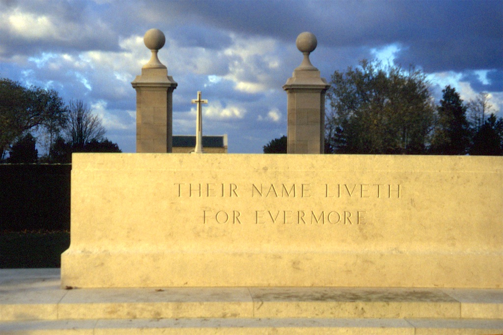 THEIR NAME LIVETH FOR EVERMORE is engraved on a stone wall