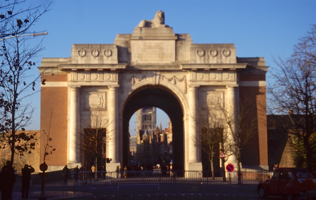 A large building shaped archway over a road.